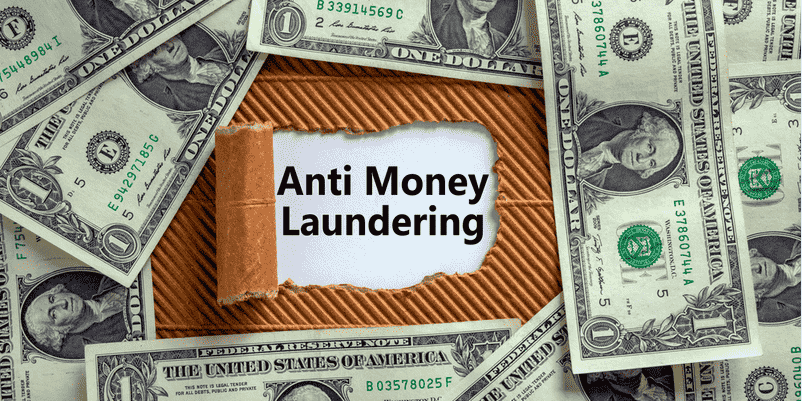 ドル札の中に「Anti money laundering」の文字がある画像